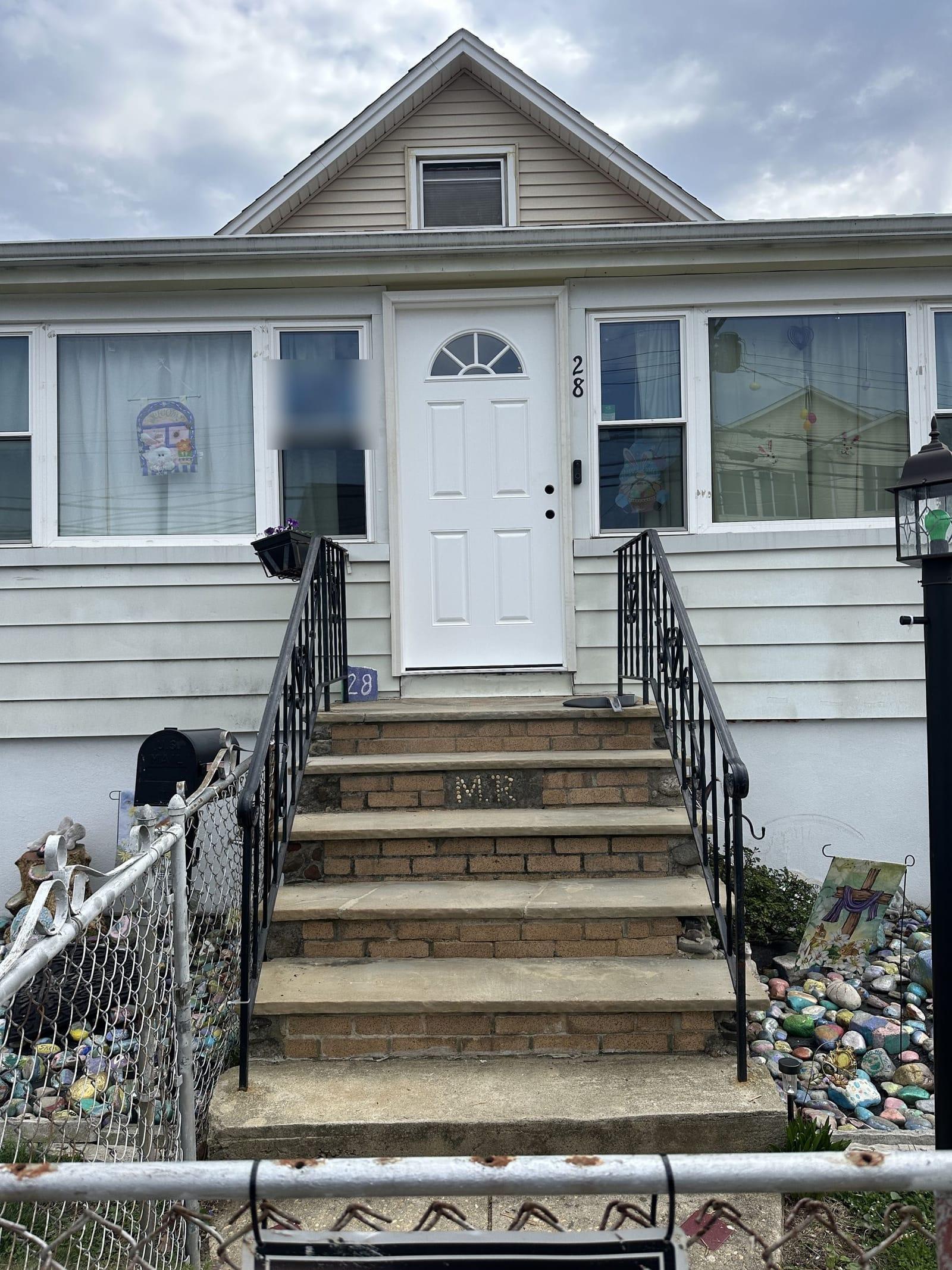 New six-panel entry door with fanlight installed on Monmouth County NJ home