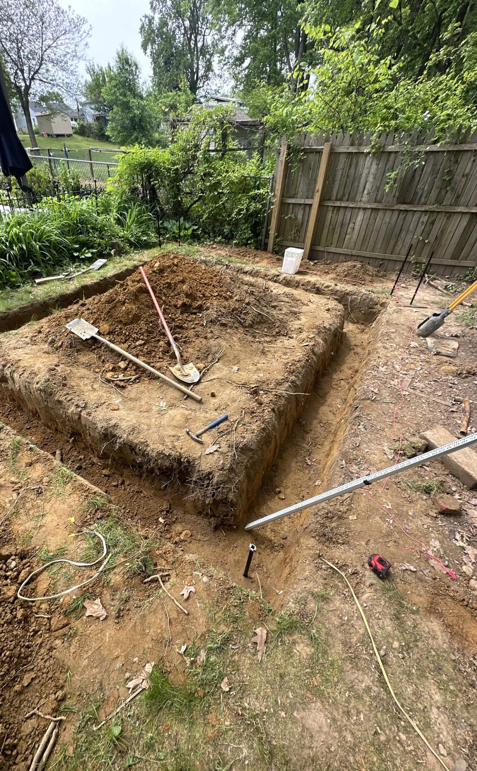 Foundation excavation dug square and level for backyard structure